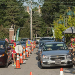 cars line up for moving in students