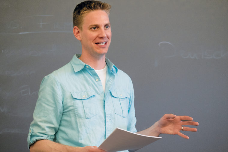 Abram Van Engen, associate professor of English and affiliated faculty member with the Danforth Center on Religion and Politics, teaches undergraduates in his course “City on a Hill: The Concept and Culture of American Exceptionalism.” (Sid Hastings/WUSTL Photos)