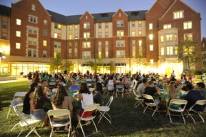 Students dine in the courtyard outside Eliot House. (Photo: Kevin Lowder/Washington University)