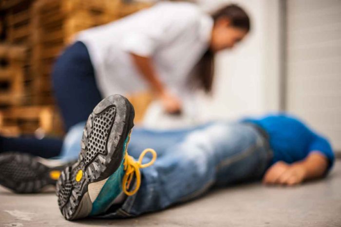 person checks on patient having seizure