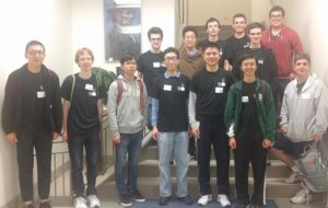 Members of the four teams representing Washington University at the ACM International Collegiate Programming Contest in Springfield, Ill., last month, with Dennis Cosgrove (front, far right).