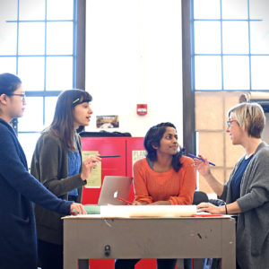 students and faculty talk at Sam Fox