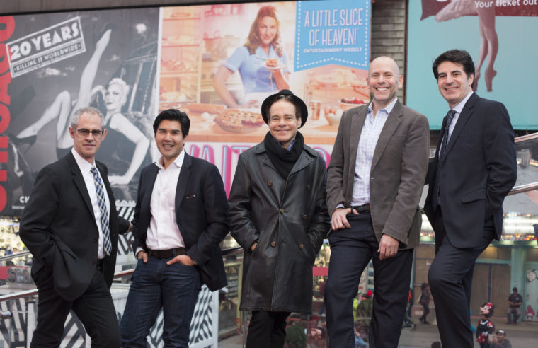 Washington University alumni make an impact on Broadway: (from left) Keith Sherman, Pun Bandhu, Steven Sater, Eric Schnall and Michael Sinder gather in Times Square. (Photo: Jennifer Weisbord, BFA ’92)