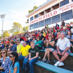 Alumni, students, parents and friends watch the football Bears square off against the Case Western Reserve University Spartans during Fall Festival. (Joe Angeles/Washington University)