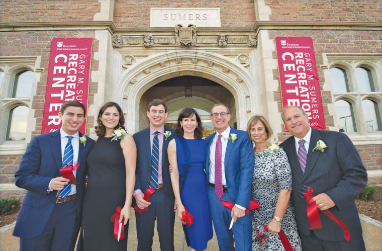 Members of the Sumers family gathered at the dedication of the Gary M. Sumers Recreation Center Oct. 28, 2016: (from left) James Sumers; Katie Sumers; Brian Sumers; Elizabeth Fowler; Gary Sumers, AB ’75; Marsha Goldberg; and Stephen Goldberg. (Joe Angeles/Washington University)