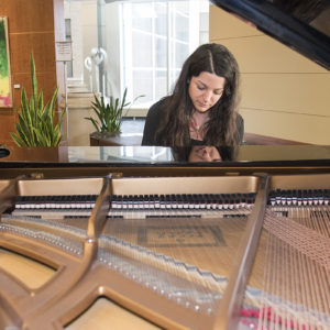 student plays piano