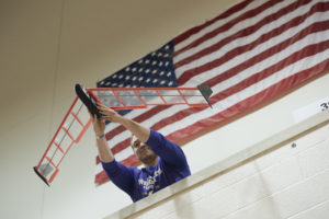 a student launches a glider during the Boeing Engineering Challenge