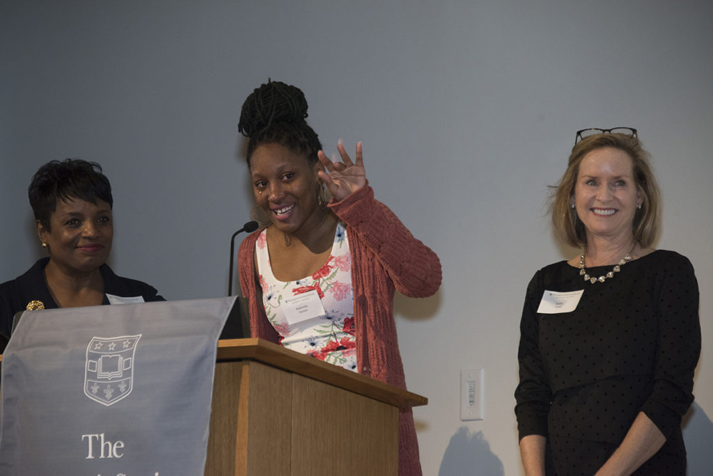 Women's Society scholarship winner waves to family