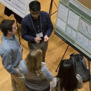 students discuss their research