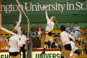 volleyball player hits the ball