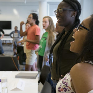 several minority students laugh together