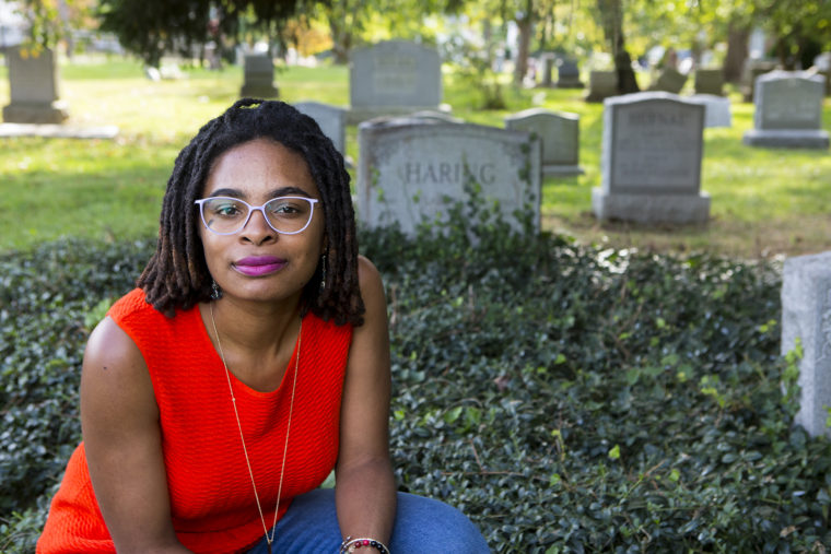 Jamie Thomas in a graveyard.