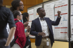 Amal Taylor, right, a second-year medical student, talks with other students