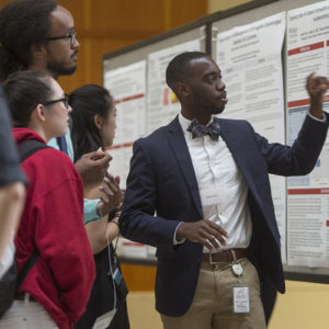 Amal Taylor, right, a second-year medical student, talks with other students