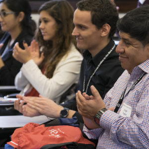 people listen to a speaker