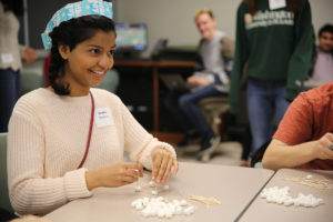 student builds with marshmallows and toothpicks