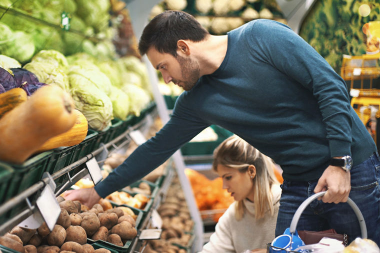 people choosing items in a grocery store