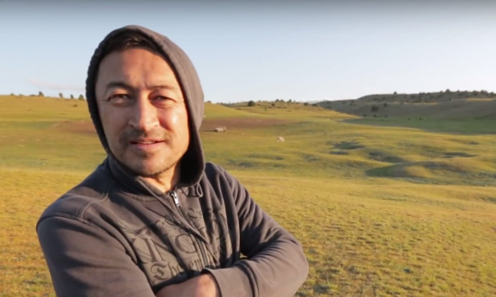 Uzbek archaeologist Farhad Maksudov surveys high mountain pastures near Tashbulak where nomads have grazed their herds for thousands of years.