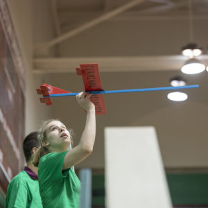 student flies glider in Field House