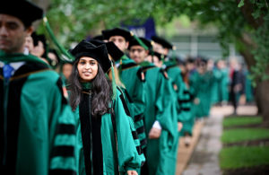 Graduates walking into Quad