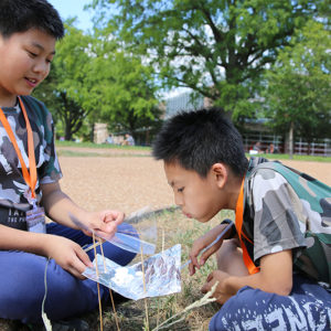 boys leading a science experiment