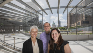 Three alumni — (from left) Anna Leavey, Eric Moraczeswski and Sarah Melinger — work for the Gateway Arch Park Foundation, which joined public and private organizations in a multi-year effort to refurbish the museum and grounds connected to the Gateway Arch. (Joe Angeles/Washington University)