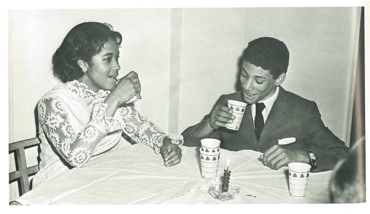 Malcolm Ryder, the first black student to live in The Westminster School's boy's dormitory beginning in the fall of 1968, enjoys a drink with Janice Kemp, one of three black girls who desegregated Westminster in 1967. Image from 1969 Lynx Yearbook, courtesy of Beck Archives-Westminster.