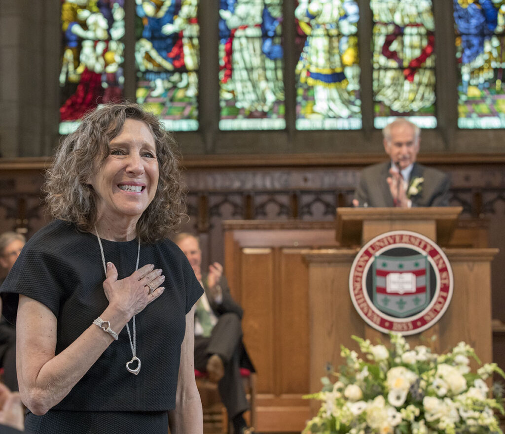 In 2018, the Newman family honored Risa by naming a study area in the Newman Tower of Collections and Exploration in Olin Library, Risa's Landing. Here, Andrew Newman makes the announcement in Graham Chapel. Photos by Joe Angeles/Washington University