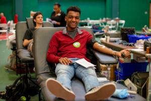 student donates blood