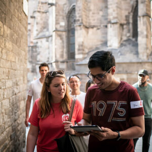 students look at a map while exploring Barcelona.