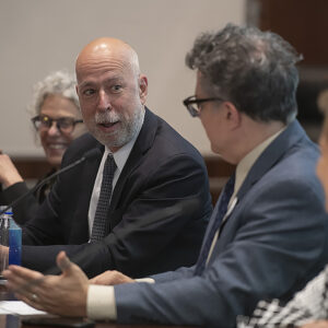 Adam Liptak talking to Greg Magarian at a panel.