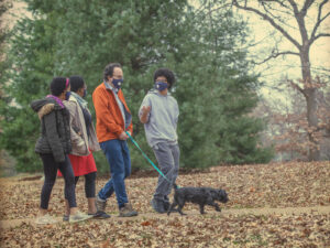The Nussinov family — (from left) Maya, Tsitsi, Zohar and Ethan — walking their dog, Pi, in Clayton’s Oak Knoll Park. (Photo: Joe Angeles/Washington University)
