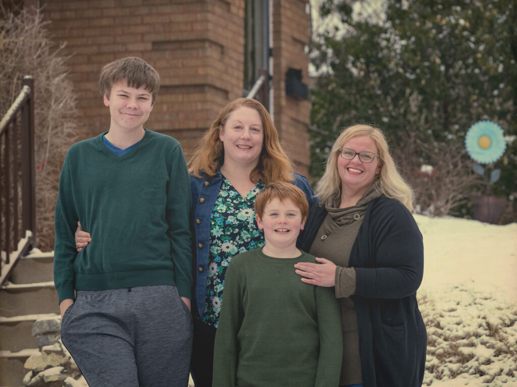 Family in front of home