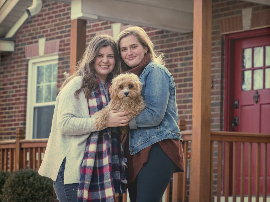 Sisters in front of home