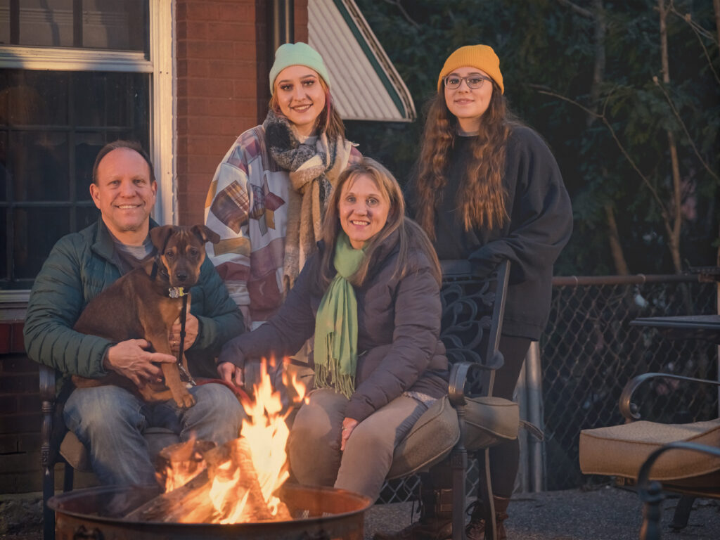 Family in backyard of home