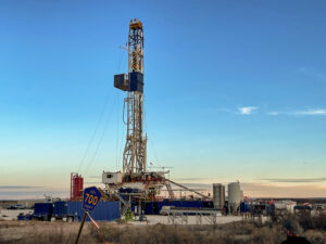 Fracking machinery at sunset