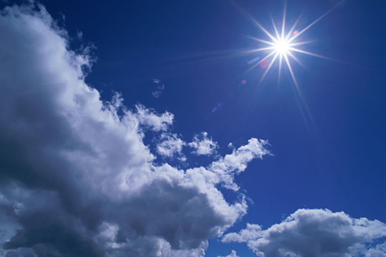 Scattered cumulus clouds and bright