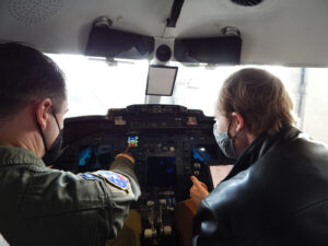 C-21 pilot Capt. Chandler Thorpe, 458th Airlift Squadron, and Washington University graduate student Kyle Gero go through a pre-flight checklist. Gero is a graduate student, who is collaborating with Scott’s Elevate innovation team and the squadron on a C-21 cockpit trainer project. The C-21 aircraft inventory went through an avionics upgrade in 2019, however, the training simulator uses the older cockpit configuration.