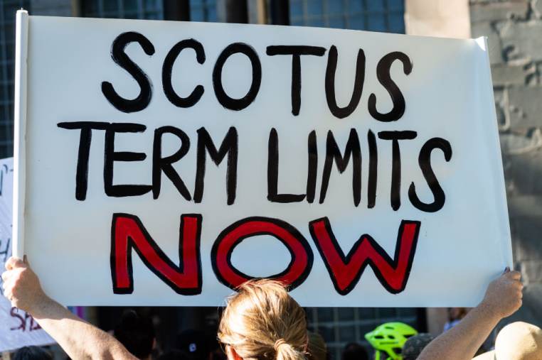 A demonstrator holding a sign reading "SCOTUS Term Limits" during a Bans off our Bodies rally following the Supreme Court ruling overturning Roe v. Wade.