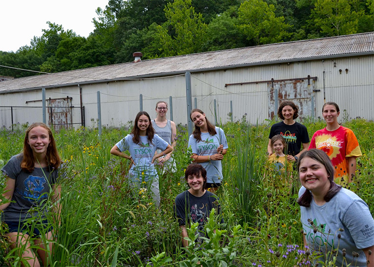 students and professors in field