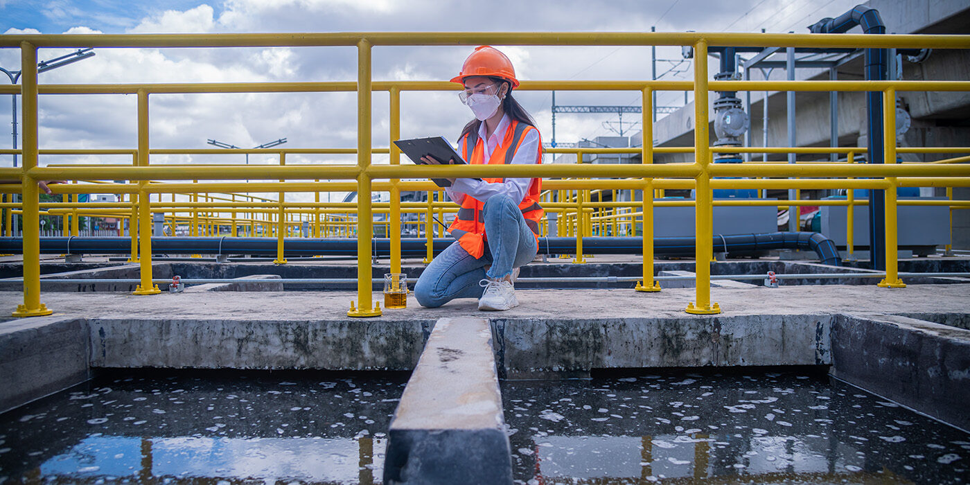 worker at wastewater treatment plant