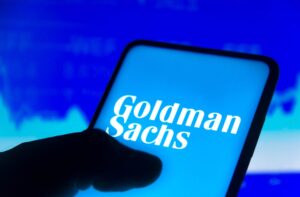 Graphic of thumb on cell phone page with words Goldman Sachs