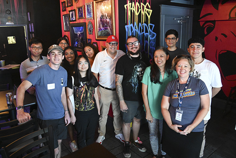 During Bear Beginnings orientation in August 2022, Chancellor Andrew Martin (center) and Anna Gonzalez (green shirt), vice chancellor for student affairs, took first-year students on a food tour of the South Grand neighborhood, because one of the best ways to build community and to get to know a community is through food. (Photo: Michael Thomas)