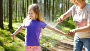 applying bug spray