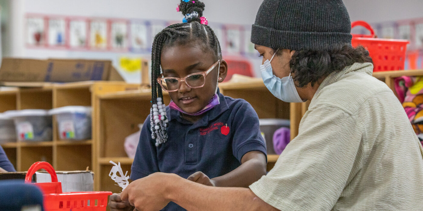 Akiva Groener, a student in the College of Architecture works on a project with kindergartner Ava Prothro at Blossom Wood Day School. (Photo: Joe Angeles)