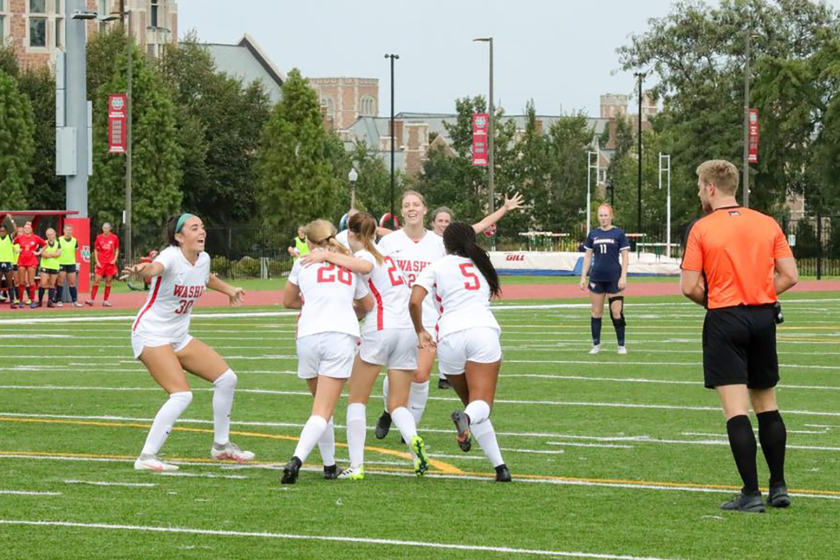 The WashU Bears Women’s Soccer team celebrate a win