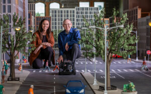 Constance Vale (left) and Eugene Vorobeychik amid their “WashU Mini-City” (Photo: Joe Angeles/Washington University)