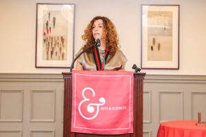Parvulescu speaking at podium.