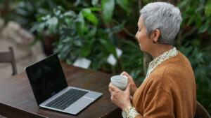 older woman looking at laptop