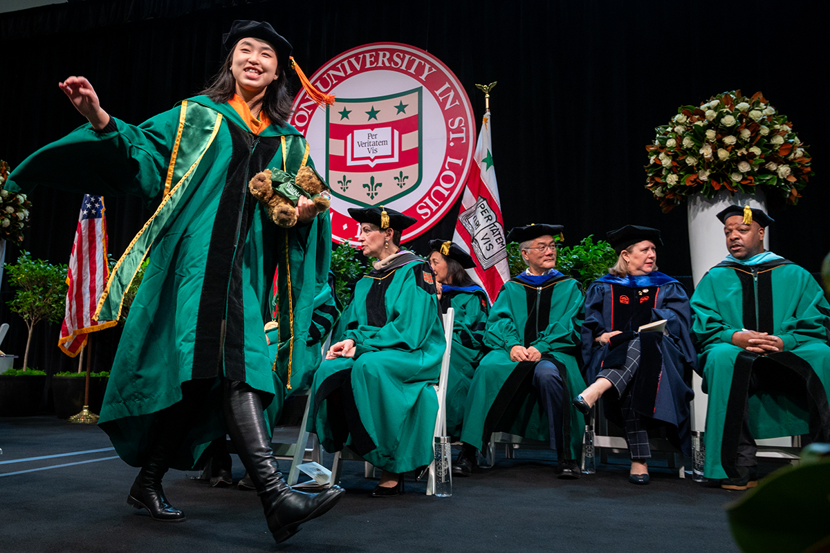 Graduates are all smiles while crossing the stage 